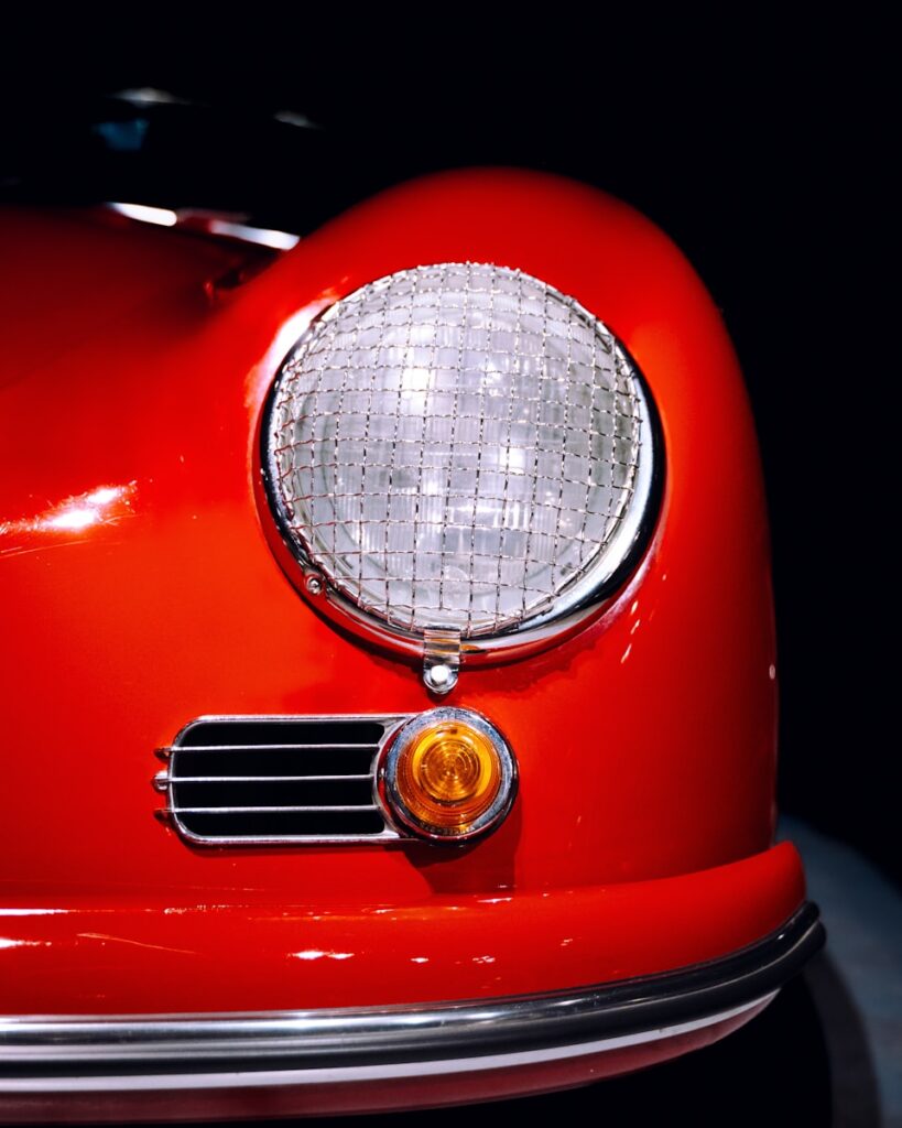 a close up of the front of a red car