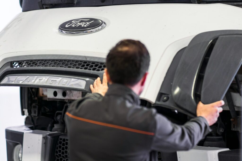 A man working on a car in a garage